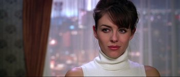 Movie still from “Austin Powers: International Man of Mystery” (1997), directed by Jay Roach – A person wearing a white sweater; Close Up shot, Over the shoulder angle