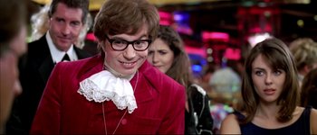 Movie still from “Austin Powers: International Man of Mystery” (1997), directed by Jay Roach – A man in a red jacket and a woman in a red jacket; Close Up shot, Low angle