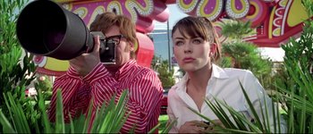 Movie still from “Austin Powers: International Man of Mystery” (1997), directed by Jay Roach – A man and a woman standing next to each other; Close Up shot, Low angle