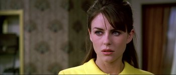 Movie still from “Austin Powers: International Man of Mystery” (1997), directed by Jay Roach – A person wearing a yellow shirt; Close Up shot, Over the shoulder angle