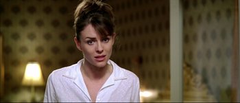 Movie still from “Austin Powers: International Man of Mystery” (1997), directed by Jay Roach – A person wearing a white shirt; Close Up shot, Over the shoulder angle