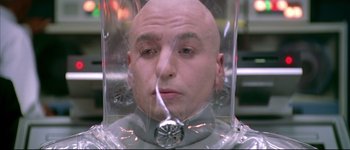 Movie still from “Austin Powers: International Man of Mystery” (1997), directed by Jay Roach – A man with bald head in a plastic bag; Close Up shot, High angle
