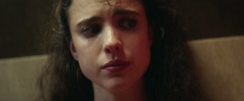 Movie still from “Stars at Noon” (2022), directed by Claire Denis – A person with a tear in her eye; Close Up shot, Low angle