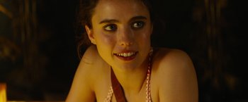 Movie still from “Stars at Noon” (2022), directed by Claire Denis – A woman's face in the dark; Close Up shot, High angle