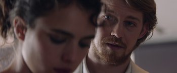 Movie still from “Stars at Noon” (2022), directed by Claire Denis – A man and a woman's face; Close Up shot, Over the shoulder angle