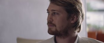 Movie still from “Stars at Noon” (2022), directed by Claire Denis – A person with a beard; Close Up shot, Low angle