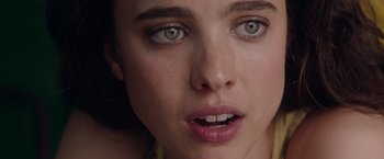 Movie still from “Stars at Noon” (2022), directed by Claire Denis – A woman's eyes and lips; Extreme Close Up shot, Low angle