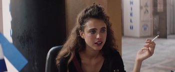 Movie still from “Stars at Noon” (2022), directed by Claire Denis – A young woman sitting in front of a mirror; Close Up shot, Over the shoulder angle