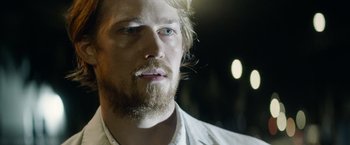 Movie still from “Stars at Noon” (2022), directed by Claire Denis – A person with a beard; Close Up shot, Low angle