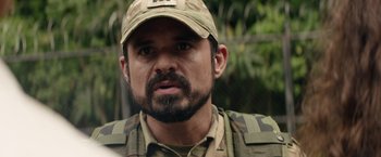 Movie still from “Stars at Noon” (2022), directed by Claire Denis – A person wearing a hat; Close Up shot, Over the shoulder angle