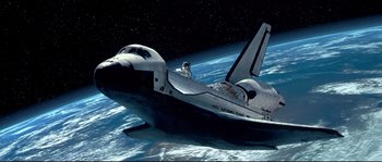 Movie still from “Austin Powers: The Spy Who Shagged Me” (1999), directed by Jay Roach – An image of a space shuttle in the middle of the earth; Extreme Wide shot, Overhead angle