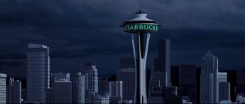 Movie still from “Austin Powers: The Spy Who Shagged Me” (1999), directed by Jay Roach – A view of a starbucks sign on top of the space needle; Extreme Wide shot, High angle