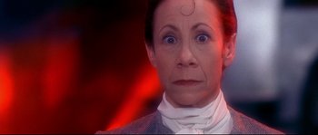 Movie still from “Austin Powers: The Spy Who Shagged Me” (1999), directed by Jay Roach – An older woman looking at the camera with a strange look on her face; Close Up shot, Low angle