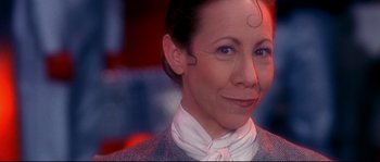 Movie still from “Austin Powers: The Spy Who Shagged Me” (1999), directed by Jay Roach – A person wearing a suit and tie; Close Up shot, Low angle