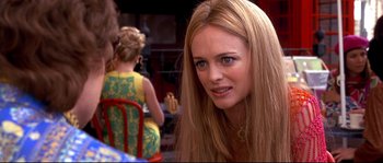 Movie still from “Austin Powers: The Spy Who Shagged Me” (1999), directed by Jay Roach – A person with long blonde hair; Close Up shot, Over the shoulder angle