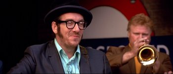 Movie still from “Austin Powers: The Spy Who Shagged Me” (1999), directed by Jay Roach – A person wearing glasses and a hat; Close Up shot, Low angle