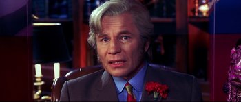 Movie still from “Austin Powers: The Spy Who Shagged Me” (1999), directed by Jay Roach – A person wearing a suit and tie; Close Up shot, Low angle