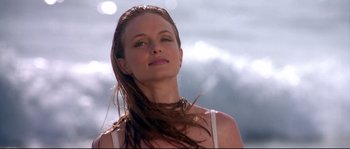 Movie still from “Austin Powers: The Spy Who Shagged Me” (1999), directed by Jay Roach – A beautiful woman with long brown hair standing in the sunlight; Close Up shot, Low angle