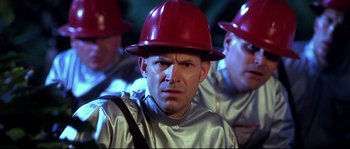 Movie still from “Austin Powers: The Spy Who Shagged Me” (1999), directed by Jay Roach – A group of men wearing red hard hats; Close Up shot, Low angle