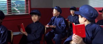 Movie still from “Austin Powers: The Spy Who Shagged Me” (1999), directed by Jay Roach – A group of young people sitting in a room; Medium shot, High angle