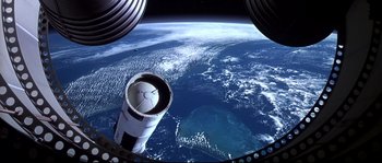 Movie still from “Austin Powers: The Spy Who Shagged Me” (1999), directed by Jay Roach – A view of the earth taken from a space station window; Extreme Wide shot, Overhead angle