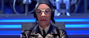 Movie still from “Austin Powers: The Spy Who Shagged Me” (1999), directed by Jay Roach – An older man wearing a leather jacket and goggles; Close Up shot, Low angle