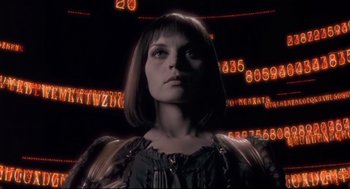 Movie still from “Avalon” (2001), directed by Mamoru Oshii – A woman is standing in front of numbers; Close Up shot, Low angle