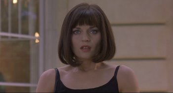 Movie still from “Avalon” (2001), directed by Mamoru Oshii – A person wearing a black shirt; Close Up shot, Over the shoulder angle