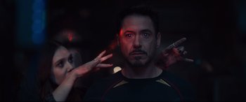 Movie still from “Avengers: Age of Ultron” (2015), directed by Joss Whedon – A person holding a cell phone; Close Up shot, Over the shoulder angle
