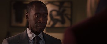 Movie still from “Avengers: Age of Ultron” (2015), directed by Joss Whedon – A person wearing a suit and tie; Close Up shot, Over the shoulder angle