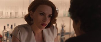 Movie still from “Avengers: Age of Ultron” (2015), directed by Joss Whedon – A woman with red hair is looking at the camera; Close Up shot, Over the shoulder angle