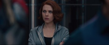 Movie still from “Avengers: Age of Ultron” (2015), directed by Joss Whedon – A person standing with her arms crossed; Close Up shot, Over the shoulder angle
