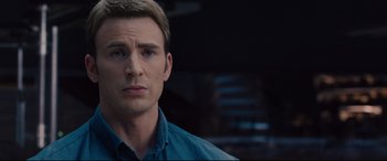 Movie still from “Avengers: Age of Ultron” (2015), directed by Joss Whedon – A person wearing a blue shirt; Close Up shot, Over the shoulder angle