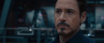 Movie still from “Avengers: Age of Ultron” (2015), directed by Joss Whedon – A person with a beard; Close Up shot, Over the shoulder angle