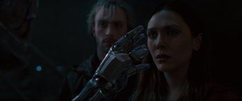 Movie still from “Avengers: Age of Ultron” (2015), directed by Joss Whedon – A man and a woman are holding a robot arm; Close Up shot, Low angle