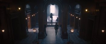Movie still from “Avengers: Age of Ultron” (2015), directed by Joss Whedon – A man and a woman are walking through an archway; Wide shot, Low angle