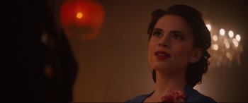 Movie still from “Avengers: Age of Ultron” (2015), directed by Joss Whedon – A beautiful woman looking up at the ceiling; Close Up shot, Over the shoulder angle