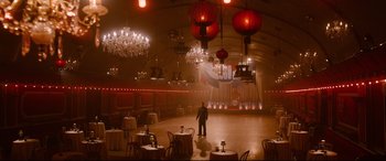 Movie still from “Avengers: Age of Ultron” (2015), directed by Joss Whedon – A man standing in the middle of an empty ballroom; Extreme Wide shot, High angle