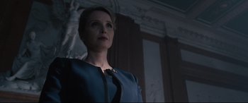 Movie still from “Avengers: Age of Ultron” (2015), directed by Joss Whedon – A woman standing in a room wearing a blue dress; Medium shot, Low angle