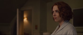 Movie still from “Avengers: Age of Ultron” (2015), directed by Joss Whedon – A woman with red hair looking to her left; Close Up shot, Over the shoulder angle