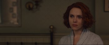 Movie still from “Avengers: Age of Ultron” (2015), directed by Joss Whedon – A person with short hair; Close Up shot, Over the shoulder angle
