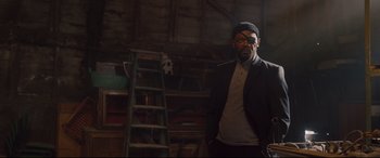 Movie still from “Avengers: Age of Ultron” (2015), directed by Joss Whedon – A man standing in front of a ladder in a room; Medium shot, Low angle