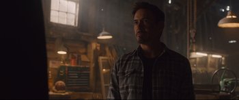 Movie still from “Avengers: Age of Ultron” (2015), directed by Joss Whedon – A person wearing a plaid shirt; Medium shot, Over the shoulder angle