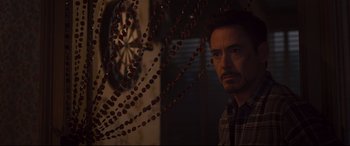 Movie still from “Avengers: Age of Ultron” (2015), directed by Joss Whedon – A person in a room near a wall; Close Up shot, Over the shoulder angle