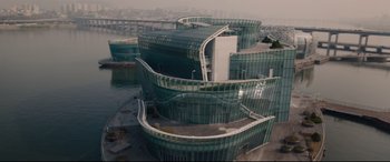 Movie still from “Avengers: Age of Ultron” (2015), directed by Joss Whedon – An aerial view of a large building with many windows; Extreme Wide shot, High angle