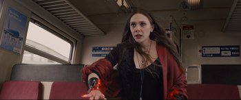 Movie still from “Avengers: Age of Ultron” (2015), directed by Joss Whedon – A woman is holding her hand out to someone; Medium shot, Low angle