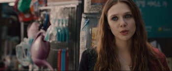 Movie still from “Avengers: Age of Ultron” (2015), directed by Joss Whedon – A person with long brown hair; Close Up shot, Over the shoulder angle