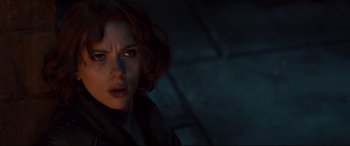 Movie still from “Avengers: Age of Ultron” (2015), directed by Joss Whedon – A person in a dark room; Close Up shot, Over the shoulder angle