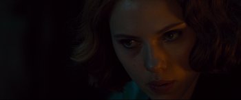 Movie still from “Avengers: Age of Ultron” (2015), directed by Joss Whedon – A woman's face in the dark; Close Up shot, Over the shoulder angle