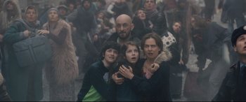 Movie still from “Avengers: Age of Ultron” (2015), directed by Joss Whedon – A group of people standing in the middle of a street; Medium shot, Low angle